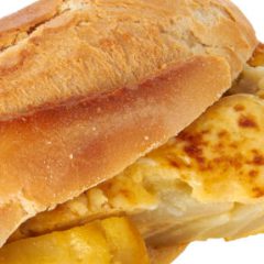 Spanish omelette sandwich isolated on white.